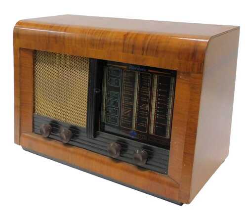 A mid 20thC walnut cased Mariner radio, 35cm high. WARNING! This lot contains untested or unsafe...