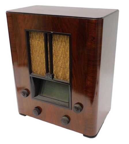 A mid 20thC walnut cased GEC Superhet DC AC radio, 46cm high. WARNING! This lot contains...