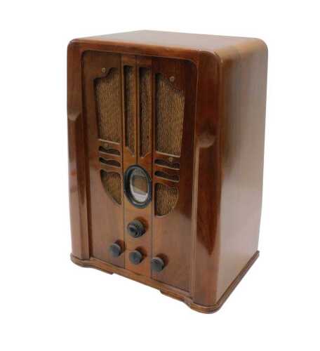 A mid 20thC walnut cased Philco tombstone style tube radio, circa 1930, 49cm high. WARNING! This...