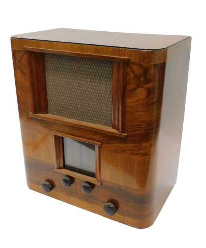 A mid 20thC walnut cased Bush AC mains receiver radio, in D end case, 52cm high. WARNING! This...