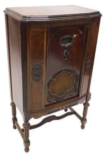 A mid 20thC walnut cased Brunswick model 15 radio receiver, circa 1930, in a freestanding...