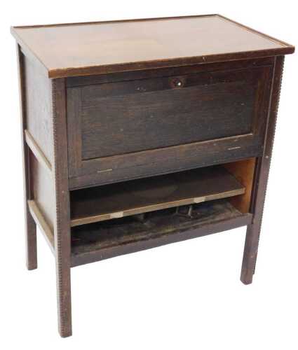 A freestanding oak cased Ekco model RG23 valve radio, in freestanding cabinet with fall front,...