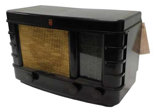 A mid 20thC Bakelite cased Philips radio receiver, 206-A, 25cm high, with ephemera. WARNING!...