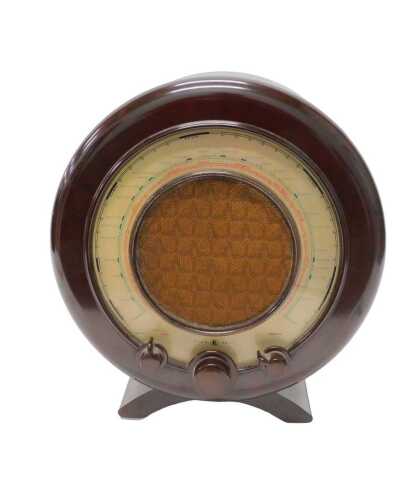 A mid 20thC Bakelite cased Ekco all electric radio receiver, type A22, circular case, on shaped...