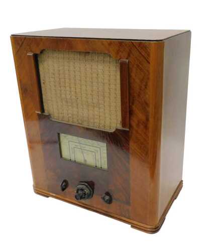A mid 20thC walnut cased Wartime Civilian receiver radio, Ekco style, 50cm high. WARNING! This...
