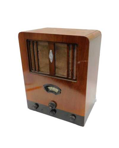 A mid 20thC walnut cased Cossor Melody Maker model 357 radio, 47cm high. WARNING! This lot...