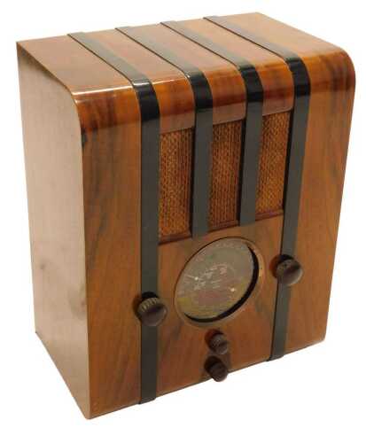 A mid 20thC walnut cased Pye tombstone style radio, with black banding, 53cm high. WARNING! This...