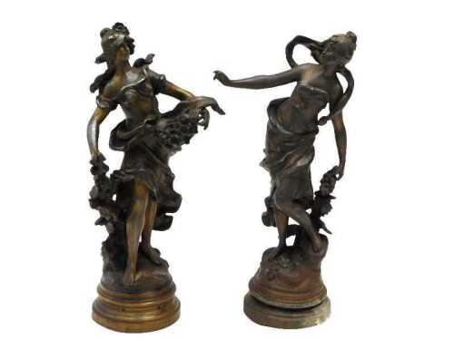 A pair of early 20thC Moreau spelter figures of dancing ladies, semi-clad on naturalistic bases,...