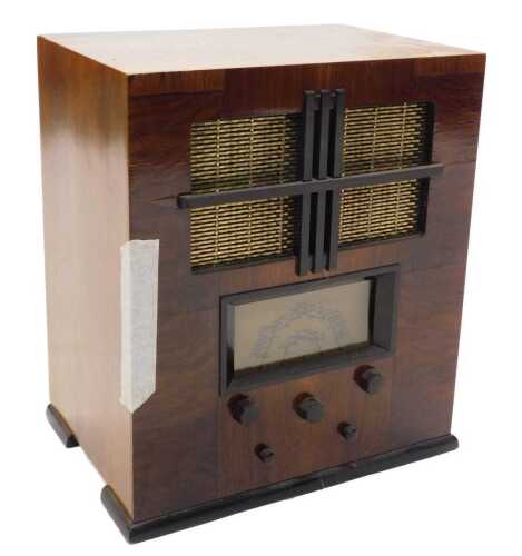 A mid 20thC walnut cased model 425 radio, 47cm high. WARNING! This lot contains untested or...