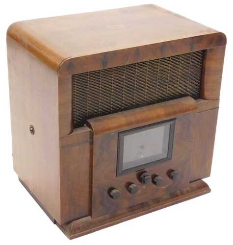 A mid 20thC walnut cased HMV radio, with front clock, possibly model 481, 51cm high. WARNING!...
