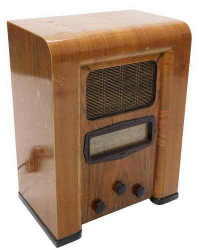 A mid 20thC walnut cased Defiant MSH921 radio, tombstone style, 59cm high. WARNING! This lot...