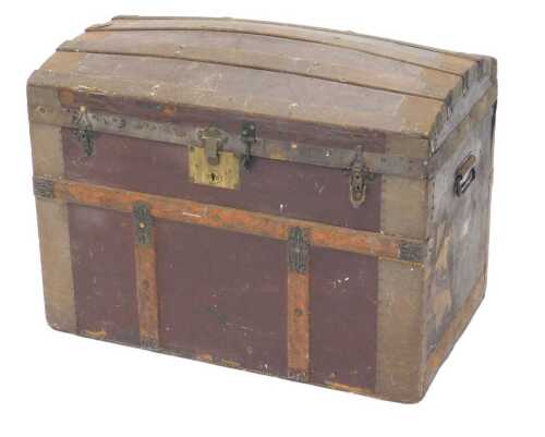 A late 19thC domed topped trunk, in pressed leather with oak banding, 53cm high, 75cm wide, 46cm...