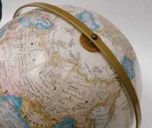 A Legend 1:31 680000 terrestrial globe, on metal axis and wooden base, 44cm high. - 2