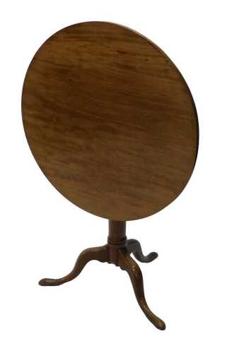 A 19thC mahogany tripod table, with one piece circular top, raised on a gun barrel stem...