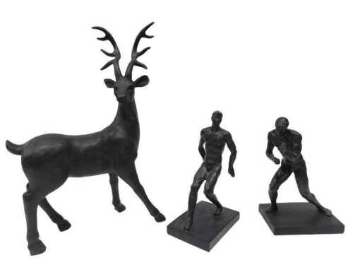 A resin spelter finish figure of a stag, 46cm high, and two nude male statues. (3)