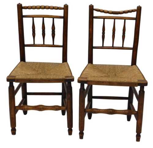 A pair of 19thC Lancashire style ash and elm kitchen chairs, with bobbin tops, above baluster...