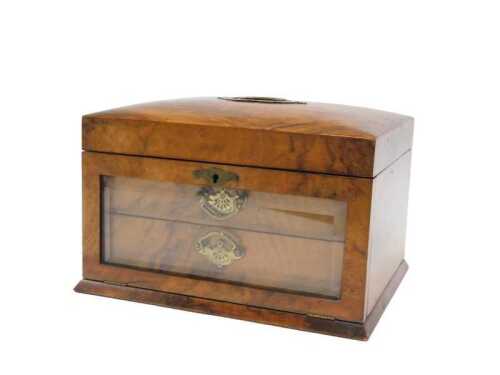 An Edwardian walnut jewellery box, with hinged lid, removable compartments, glazed front and two...