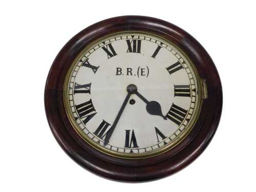 A late 19thC BR(E) Railway wall clock, the 29cm diameter Roman numeric dial housed in a stained...