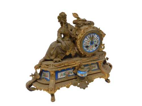 A 19thC gilt metal mantel clock, the 9cm diameter porcelain Roman numeric dial hand painted with...