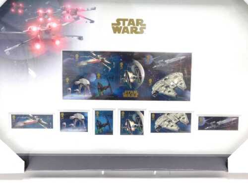 A Royal Mail Star Wars stamp set The Vehicle Stamps, glazed and framed, 18cm x 43cm. (as new)