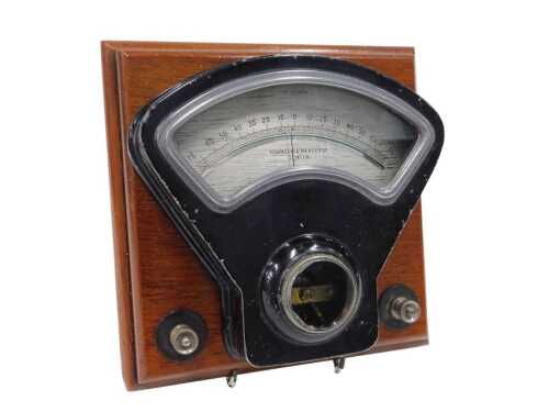 A Townson & Mercer Limited London volt metre, number 59041A, on wooden backing, marked Hanger...