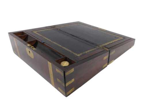A mid 19thC rosewood campaign writing slope, of rectangular form with gilt brass banding and...