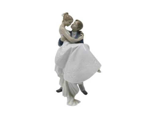 A Lladro figure group Happiest Day, 27cm high. (boxed)