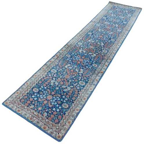 A 20thC Turkish Hereke style runner, with outer field of flowers and other medallions, on a...