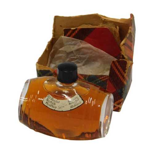 A miniature bottle of Old Blended Speciality Scotch whisky, selected heather matured barrel...