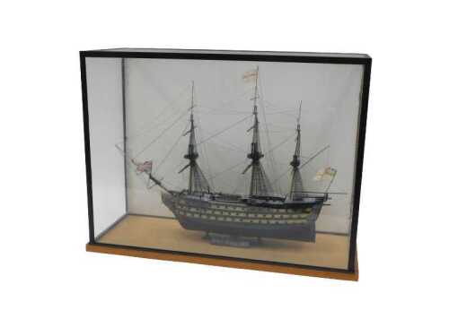A cased model of HMS Victory, 46cm wide, in glazed case.