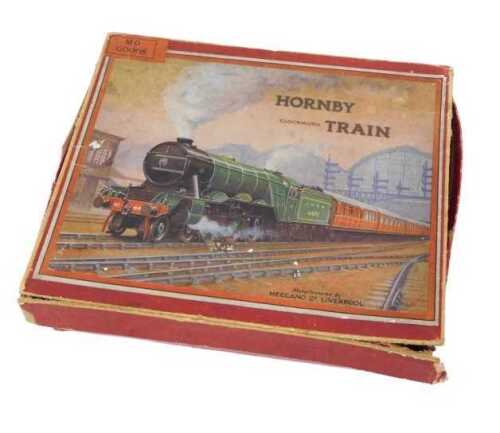 A Hornby O gauge tin plate clockwork train set, in red livery, with tender numbered 6100 and two...