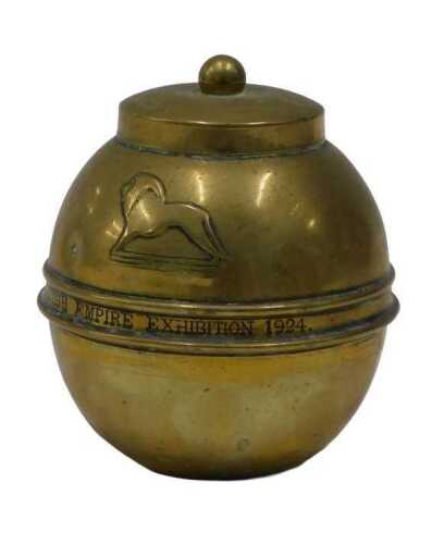 A British Empire Exhibition 1924 Lipton brass tea canister, raised with lion, 14cm high.