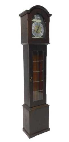 An oak cased Tempis Fugit granddaughter clock, with arched dial, raised spandrels, and plain...