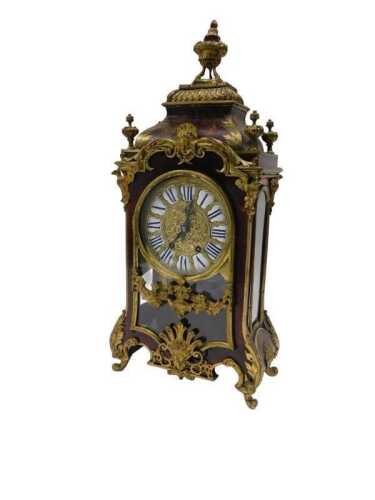 A 19thC French Boulle mantel clock, the raised enamel 15cm diameter Roman numeric dial in highly elaborate case, with caddy top surmounted by single urn and four further urn finials, the glazed front raised with urns, flowers and scrolls, on scroll feet, 