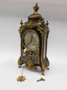 A 19thC French Boulle mantel clock, the raised enamel 15cm diameter Roman numeric dial in highly elaborate case, with caddy top surmounted by single urn and four further urn finials, the glazed front raised with urns, flowers and scrolls, on scroll feet, - 2