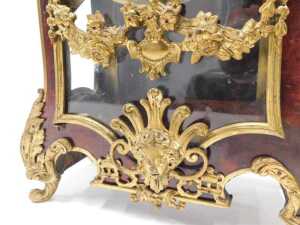 A 19thC French Boulle mantel clock, the raised enamel 15cm diameter Roman numeric dial in highly elaborate case, with caddy top surmounted by single urn and four further urn finials, the glazed front raised with urns, flowers and scrolls, on scroll feet, - 9