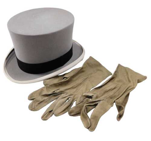 A 20thC Hill House and Co top hat, in grey, with black trim, size 7, in outer box, with kid gloves.