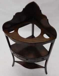 A George III mahogany corner washstand, with a raised back and recesses for bowl and beakers and... - 2
