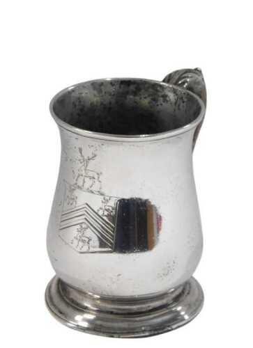 A George II silver mug, by Fuller White, with plain bulbous body, leaf capped scroll handle,...