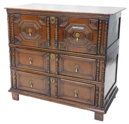 A late 17thC oak chest of drawers, the top with a moulded edge above three panelled drawers,...