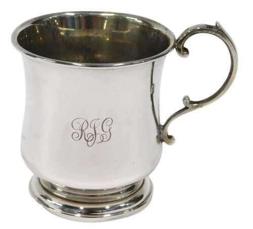 A George VI silver mug, by the Adie Brothers, with circular body, shaped handle, and circular...