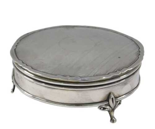An early 20thC powder box, partially engine turned, vacant cartouche, Birmingham marks rubbed,...