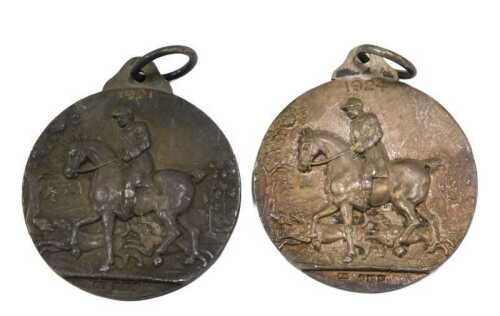 A silver medallion Light Horse Breeding Society, with ring top, raised with horses, 1921, and...