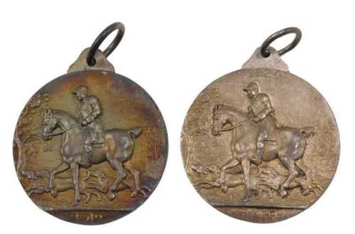 A silver medallion Light Horse Breeding Society, with ring top, raised with horses, 1912, and...