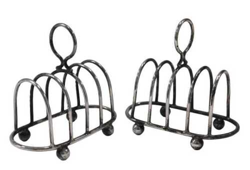 A pair of Edward VII silver miniature toast racks, by Elkington & Co, four sections on orb feet,...