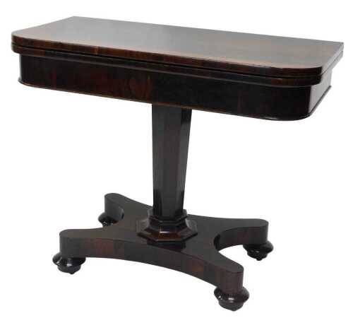 An early Victorian rosewood card table, the rectangular top with rounded corners on an octagonal...