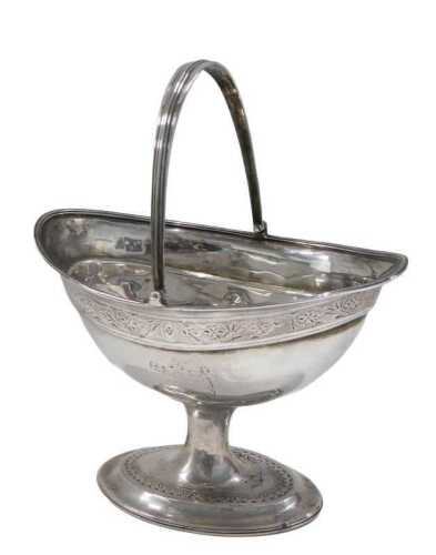 An 18thC Dublin silver basket, with strapwork swing handle, upper etched cape bowl, with part...