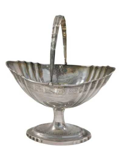 An early 19thC Irish silver basket, by Joseph Jackson, with swing handle, shaped bowl, inverted...