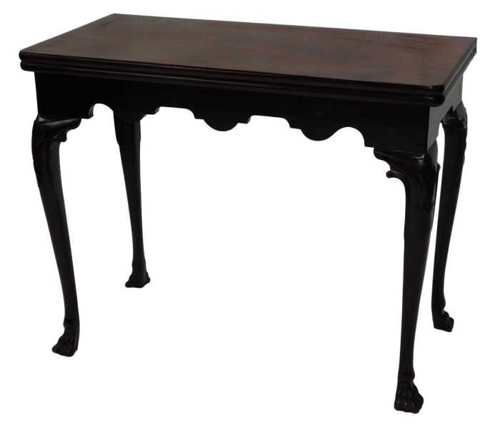 A George II mahogany card table, the rectangular foldover top baize lined, above a shaped apron...