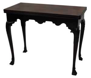 A George II mahogany card table, the rectangular foldover top baize lined, above a shaped apron...